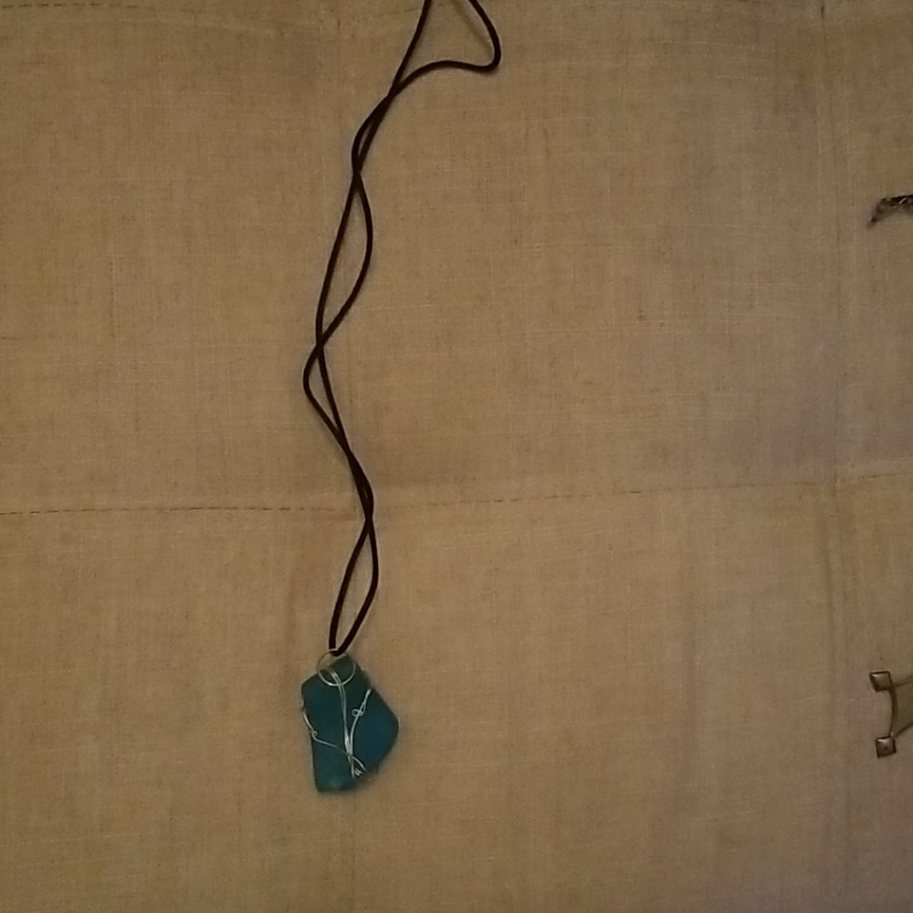 Topaz like stone on string